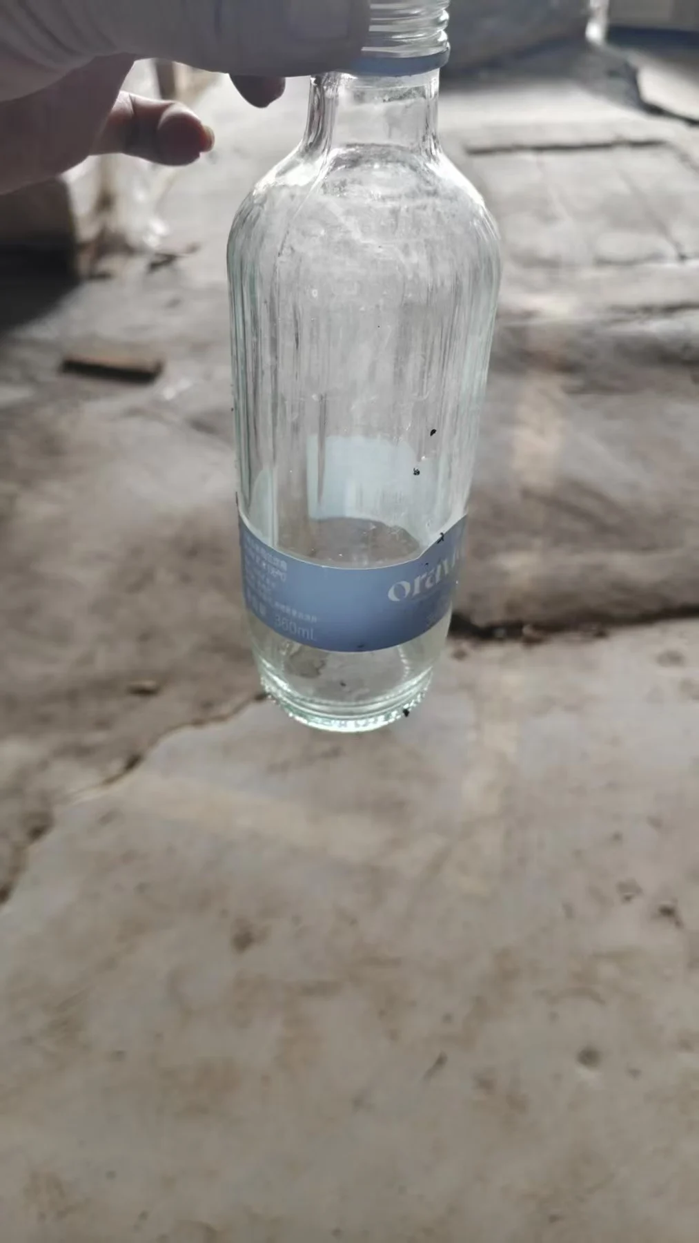 A clear glass bottle used in the project